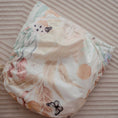 Load image into Gallery viewer, Reusable Cloth Nappy – Palm Garden | 2.0 | My Little Gumnut folded flat to highlight the palm-inspired design detail.