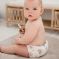 Load image into Gallery viewer, Baby wearing a Reusable Cloth Nappy – Pastel Medley | 2.0 | My Little Gumnut shown sitting to demonstrate fit and comfort.
