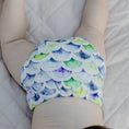 Load image into Gallery viewer, Baby wearing a Reusable Cloth Nappy – Mermaid | 2.0 | My Little Gumnut with a secure fit and soft bamboo lining.