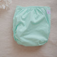 Load image into Gallery viewer, Reusable Cloth Nappy – Mint | 2.0 | My Little Gumnut folded flat to highlight the fresh mint colour detail.