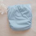 Load image into Gallery viewer, Reusable Cloth Nappy – Blue | 2.0 | My Little Gumnut folded flat to highlight the simple blue design and absorbent shape.