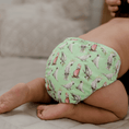 Load image into Gallery viewer, Baby wearing a Reusable Cloth Nappy – Cockatoo | 2.0 | My Little Gumnut, designed for comfort and everyday movement.