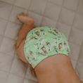 Load image into Gallery viewer, Baby wearing a Reusable Cloth Nappy – Cockatoo | 2.0 | My Little Gumnut with a secure fit and soft bamboo lining.