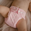 Load image into Gallery viewer, Baby wearing a Reusable Cloth Nappy – Pink | 2.0 | My Little Gumnut shown from behind to demonstrate fit and comfort.