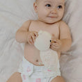 Load image into Gallery viewer, Baby wearing a Reusable Cloth Nappy – Flowers | 2.0 | My Little Gumnut, designed for comfort and everyday movement.