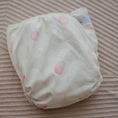 Load image into Gallery viewer, Reusable Cloth Nappy – Flowers | 2.0 | My Little Gumnut folded flat to highlight the floral print detail.