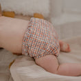 Load image into Gallery viewer, Baby wearing a Reusable Cloth Nappy – Plaid | 2.0 | My Little Gumnut shown from behind to demonstrate fit and comfort.
