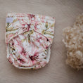 Load image into Gallery viewer, Reusable Cloth Nappy – Lily | 2.0 | My Little Gumnut displayed flat to showcase the soft floral print and adjustable snaps.