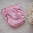 Load image into Gallery viewer, Reusable Cloth Nappy – Monstera Pink | 2.0 | My Little Gumnut folded flat to highlight the Monstera-inspired design detail.