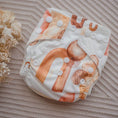 Load image into Gallery viewer, Reusable Newborn Cloth Nappy - Archie featuring a unique neutral-inspired design with buttons and snaps.