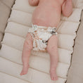 Load image into Gallery viewer, Reusable Newborn Cloth Nappy with a tropical design on an infant, showcasing comfort and style.