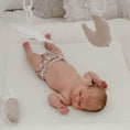 Load image into Gallery viewer, Reusable Newborn Cloth Nappy – Plaid print on newborn baby lying on a soft play mat