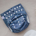 Load image into Gallery viewer, Reusable Cloth Nappy – Monstera Blue | 2.0 | My Little Gumnut displayed flat to showcase the blue botanical print and adjustable snaps.