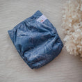 Load image into Gallery viewer, Reusable Cloth Nappy – Monstera Blue | 2.0 | My Little Gumnut folded flat to highlight the leafy Monstera-inspired design.