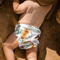 Load image into Gallery viewer, Reusable Swim Nappy featuring Australian-inspired design on a baby at the beach.