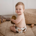 Load image into Gallery viewer, Baby wearing a Reusable Cloth Nappy – Aussie Animals | 2.0 | My Little Gumnut, sitting comfortably during everyday play.