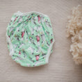 Load image into Gallery viewer, Reusable Swim Nappy - Cockatoo design featuring colorful cockatoos on a green background, ideal for beach and pool days.