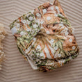 Load image into Gallery viewer, Reusable Cloth Nappy – Dino Land | 2.0 | My Little Gumnut displayed flat to showcase the dinosaur-inspired print and adjustable snaps.