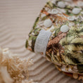 Load image into Gallery viewer, Reusable Cloth Nappy – Dino Land | 2.0 | My Little Gumnut folded flat to showcase the dinosaur print and adjustable fit.