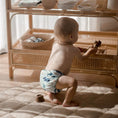 Load image into Gallery viewer, Baby wearing a Reusable Cloth Nappy – Marine Life | 2.0 | My Little Gumnut shown walking to demonstrate comfort and flexibility.