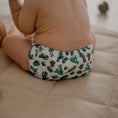 Load image into Gallery viewer, Baby wearing a Reusable Cloth Nappy – Cacti | 2.0 | My Little Gumnut with a secure fit and soft bamboo lining.