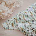 Load image into Gallery viewer, Reusable Cloth Nappy – Banksia | 2.0 | My Little Gumnut folded flat to display the native floral print detail.