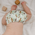 Load image into Gallery viewer, Baby wearing a Reusable Cloth Nappy – Banksia | 2.0 | My Little Gumnut with adjustable sizing and soft bamboo lining.