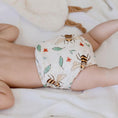 Load image into Gallery viewer, Reusable Cloth Nappy – Bees | 2.0 | My Little Gumnut shown on a baby to demonstrate fit and comfort.