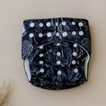 Load image into Gallery viewer, Reusable Cloth Nappy – Black Flora | 2.0 | My Little Gumnut displayed flat to showcase the floral print and adjustable snaps.