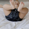 Load image into Gallery viewer, Reusable Cloth Nappy – Black Flora | 2.0 | My Little Gumnut shown on a baby to highlight fit, comfort and sizing.