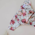 Load image into Gallery viewer, Reusable Cloth Nappy – Blush Botanical | 2.0 | My Little Gumnut folded flat to showcase the floral print and adjustable design.
