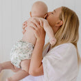 Load image into Gallery viewer, Baby wearing a Reusable Cloth Nappy – Eucalyptus Green | 2.0 | My Little Gumnut shown with parent to demonstrate fit and comfort.