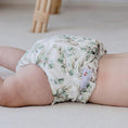 Load image into Gallery viewer, Baby wearing a Reusable Cloth Nappy – Eucalyptus Green | 2.0 | My Little Gumnut with a secure fit and soft bamboo lining.