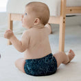 Load image into Gallery viewer, Baby wearing a Reusable Cloth Nappy – Gumnut Teal | 2.0 | My Little Gumnut, designed for comfort and everyday movement.