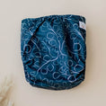 Load image into Gallery viewer, Reusable Cloth Nappy – Gumnut Teal | 2.0 | My Little Gumnut folded flat to highlight the bold teal print detail.