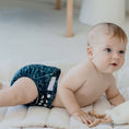 Load image into Gallery viewer, Baby wearing a Reusable Cloth Nappy – Gumnut Teal | 2.0 | My Little Gumnut shown crawling to demonstrate fit and comfort.
