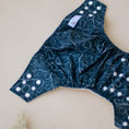 Load image into Gallery viewer, Reusable Cloth Nappy – Gumnut Teal | 2.0 | My Little Gumnut folded flat to showcase the teal print and adjustable fit.