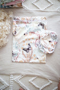 Load image into Gallery viewer, Palm Garden reusable wet bag laid flat showing tropical botanical design 💚