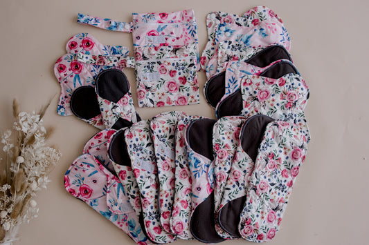 Reusable menstrual pads by my little gumnut. cloth menstrual pads. period pads. stack of menstrual pads. floral pads