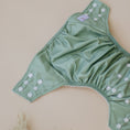 Load image into Gallery viewer, Reusable Cloth Nappy – Sage | 2.0 | My Little Gumnut folded flat to showcase the sage colour and adjustable fit.