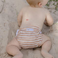 Load image into Gallery viewer, Baby wearing a brown stripe reusable swim nappy by My Little Gumnut, perfect for beach days and pool play.