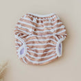 Load image into Gallery viewer, Reusable Swim Nappy in brown stripes, lightweight and designed for beach days and pool play.