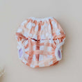 Load image into Gallery viewer, Reusable Swim Nappy in gingham rust pattern, featuring snaps for a secure fit, perfect for beach and pool days.