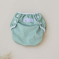 Load image into Gallery viewer, Reusable Swim Nappy - Sage in soft green color with snap buttons for reusable swim wear.