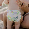 Load image into Gallery viewer, Reusable Swim Nappy - Tropical Gardens on a child, designed for comfort and reducing waste during swim activities.