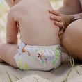 Load image into Gallery viewer, Reusable Swim Nappy on a baby during a beach day with nature-inspired designs by My Little Gumnut.