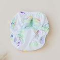 Load image into Gallery viewer, Reusable Swim Nappy in Tropical Gardens design, featuring vibrant watercolor leaves and suitable for beach and pool use.