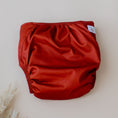 Load image into Gallery viewer, Reusable Cloth Nappy – Terracotta | 2.0 | My Little Gumnut folded flat to highlight the earthy terracotta design detail.