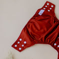 Load image into Gallery viewer, Reusable Cloth Nappy – Terracotta | 2.0 | My Little Gumnut folded flat to showcase the terracotta colour and adjustable fit.