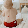 Load image into Gallery viewer, Baby wearing a Reusable Cloth Nappy – Terracotta | 2.0 | My Little Gumnut, designed for comfort and everyday movement.